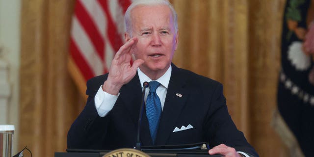 U.S. President Joe Biden responds to questions from reporters as he meets with his Competition Council in the East Room of the White House in Washington, U.S. January 24, 2022. REUTERS/Leah Millis