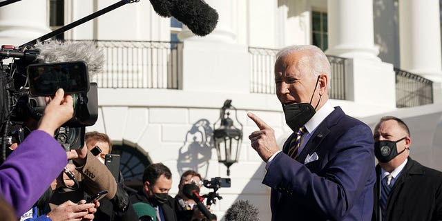 U.S. President Joe Biden speaks to reporters as he departs the White House to travel to Georgia, in Washington, U.S., January 11, 2022.