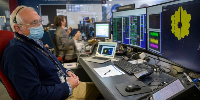 NASA James Webb Space Telescope Project Manager Bill Ochs monitors the progress of the observatory’s second primary mirror wing.