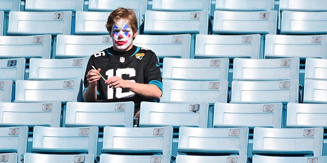 A Jacksonville Jaguars fan painted as a clown in the stands before the game between the Indianapolis Colts and the Jags at TIAA Bank Field Jan. 9, 2022, in Jacksonville, Fla. 