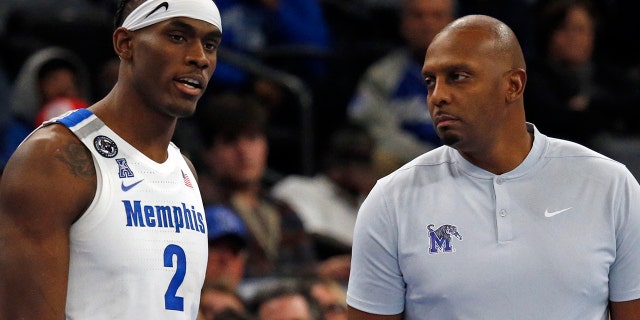 Jan 20, 2022; Memphis, Tennessee, USA; Memphis Tigers center Jalen Duren (2) talks with head coach Penny Hardaway (right) as he waits to check in during the second half against the Southern Methodist Mustangs at FedExForum.