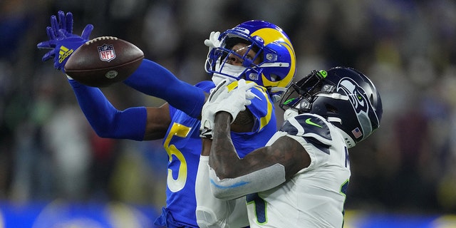 Los Angeles Rams cornerback Jalen Ramsey defends against Seattle Seahawks wide receiver DK Metcalf at SoFi Stadium in Inglewood, California, on Dec. 21, 2021.