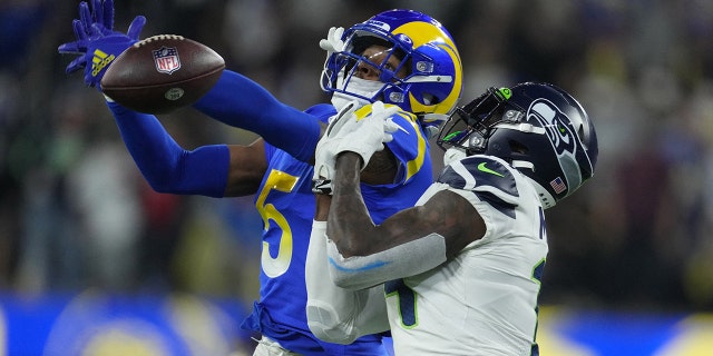 Los Angeles Rams cornerback Jalen Ramsey defends against Seattle Seahawks wide receiver DK Metcalf at SoFi Stadium in Inglewood, California, on Dec. 21, 2021.