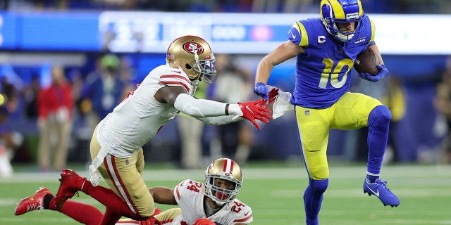 Los Angeles Rams' Cooper Kupp (10) gets past San Francisco 49ers' Jaquiski Tartt, left, and K'Waun Williams (24) during the second half of the NFC Championship NFL football game Sunday, Jan. 30, 2022, in Inglewood, Calif.