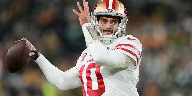 Jimmy Garoppolo of the San Francisco 49ers warms up before the game against the Green Bay Packers in the NFC divisional playoff game at Lambeau Field on Jan. 22, 2022, in Green Bay, Wisconsin.