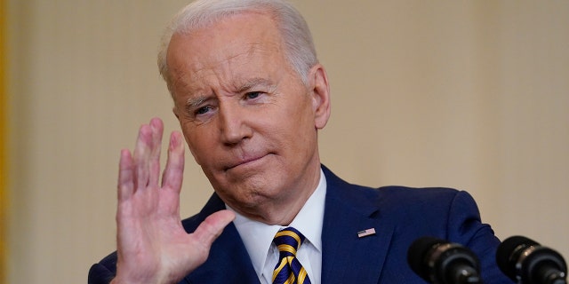 President Biden gestures as he speaks during a news conference in the East Room of the White House in Washington, Wednesday, Jan. 19, 2022.