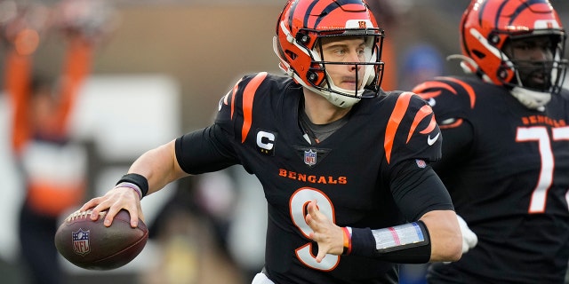 Cincinnati Bengals quarterback Joe Burrow (9) throws during the first half of an NFL wild-card playoff football game against the Las Vegas Raiders, Saturday, Jan. 15, 2022, in Cincinnati.