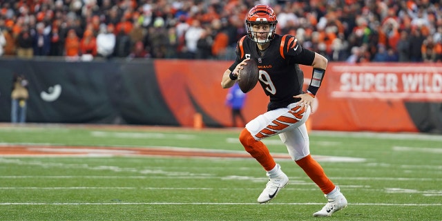 Cincinnati Bengals quarterback Joe Burrow (9) looks to throw during the first half of an NFL wild-card playoff football game against the Las Vegas Raiders, Saturday, Jan. 15, 2022, in Cincinnati.