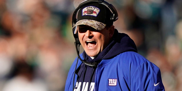 New York Giants' Joe Judge yells during the first half of an NFL football game against the Philadelphia Eagles, Sunday, Dec. 26, 2021, in Philadelphia.