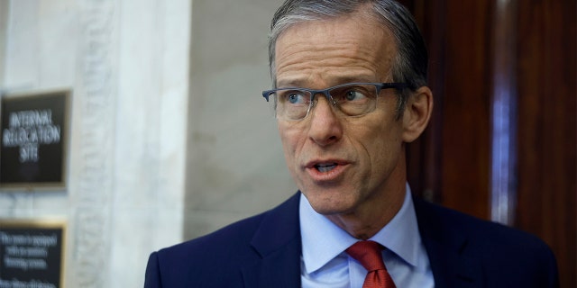 Senate Minority Whip John Thune, R-S.D., briefly speaks to reporters before heading into the weekly Senate Republican policy luncheon in the Russell Senate Office Building on Capitol Hill on Jan. 11, 2022, in Washington.
