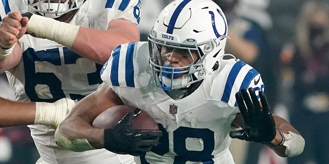 Indianapolis Colts running back Jonathan Taylor (28) plays against the Arizona Cardinals during an NFL football game on Dec. 25, 2021, in Glendale, Arizona.
