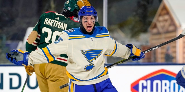 St. Louis Blues Right Wing Jordan Kyrou (25) celebrates his second period goal during the 2022 NHL Winter Classic between the St. Louis Blues and the Minnesota Wild on January 1, 2022 at Target Field in Minneapolis, ミネソタ.