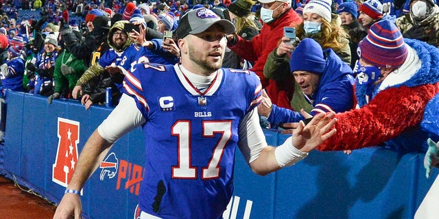 Buffalo Bills quarterback Josh Allen celebrates with fans after a win over the New York Jets, Jan. 9, 2022, in Orchard Park, New York.