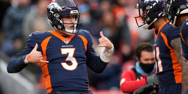 Denver Broncos quarterback Drew Lock (3) celebrates with teammates after scoring against the Kansas City Chiefs during the first half of an NFL football game Saturday, Jan. 8, 2022, in Denver.