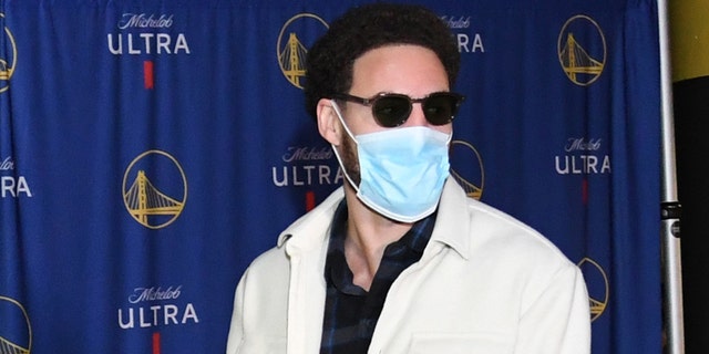Klay Thompson #11 of the Golden State Warriors arrives to the arena before the game against the Cleveland Cavaliers on January 9, 2022 at Chase Center in San Francisco, California.