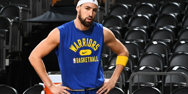 Klay Thompson #11 of the Golden State Warriors looks on prior to the game against the Phoenix Suns on December 25, 2021 at Footprint Center in Phoenix, Arizona.