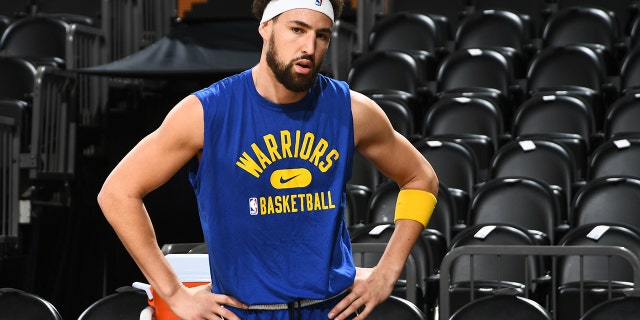 Klay Thompson #11 of the Golden State Warriors looks on prior to the game against the Phoenix Suns on December 25, 2021 at Footprint Center in Phoenix, Arizona. 