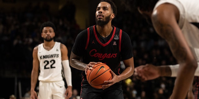 Jan 29, 2022; Orlando, Florida, USA; Houston Cougars guard Kyler Edwards (11) shoots a free throw against the UCF Knights in the first half at Addition Financial Arena.