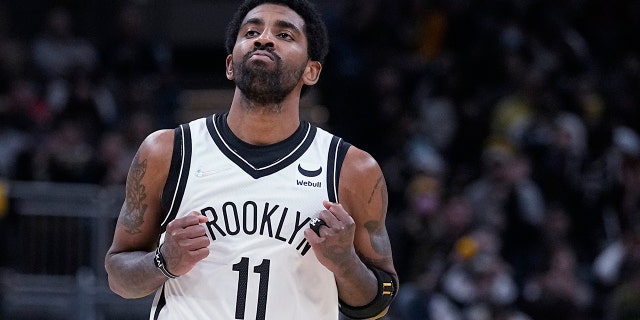Brooklyn Nets' Kyrie Irving reacts after hitting a shot during the second half of the team's NBA basketball game against the Indiana Pacers, Wednesday, Jan. 5, 2022, in Indianapolis.