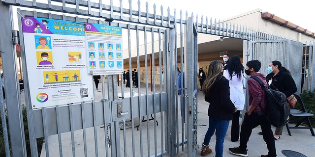 Students return to campus at Olive Vista Middle School on the first day back following the winter break amid a dramatic surge in Covid-19 cases across Los Angeles County on January 11, 2022 in Sylmar, California. (Photo by Frederic J. BROWN / AFP) (Photo by FREDERIC J. BROWN/AFP via Getty Images)