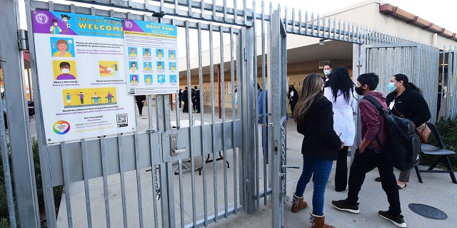 Students return to campus at Olive Vista Middle School on the first day back following the winter break amid a dramatic surge in COVID-19 cases across Los Angeles County Jan. 11, 2022 in Sylmar, Calif.