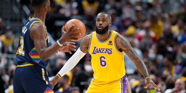 Nuggets forward Jeff Green looks to pass as Los Angeles Lakers forward LeBron James defends Saturday Jan. 15, 2022, in Denver.