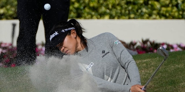 Lydia Ko of New Zealand exits the greenside bunker on the 18th hole, during the third round of the Gainbridge LPGA golf tournament, Saturday January 29, 2022, in Boca Raton, Florida.