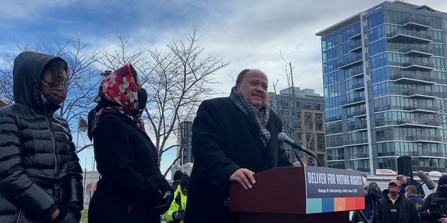 Martin Luther King III speaks to the crowd ahead of the march