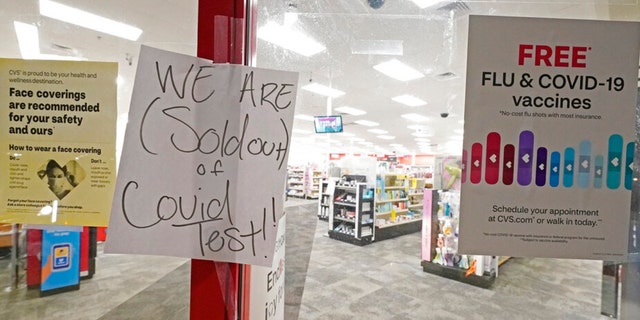 A sign was posted at the front of this CVS pharmacy at the Capitol in Jackson, Miss., Monday, Jan. 3, 2022. It was widely reported that the at-home COVID-19 tests were in very short supply throughout the state. (AP Photo/Rogelio V. Solis) 