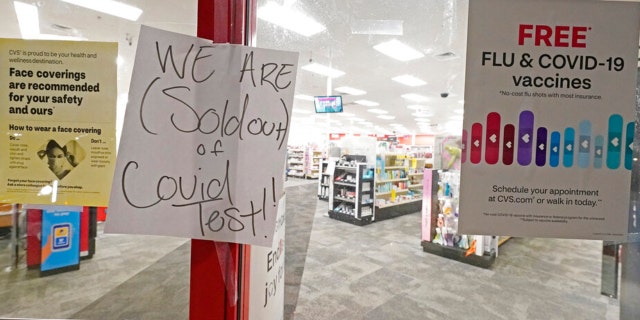 A sign was posted at the front of this CVS pharmacy at the Capitol in Jackson, Miss., Monday, Jan. 3, 2022. It was widely reported that the at-home COVID-19 tests were in very short supply throughout the state. (AP Photo/Rogelio V. Solis) 