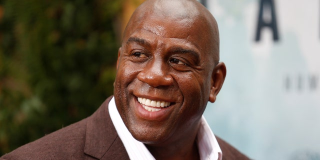 Former NBA basketball player Earvin Magic Johnson poses at the premiere of the movie "The Legend of Tarzan" in Hollywood, California, June 27, 2016.