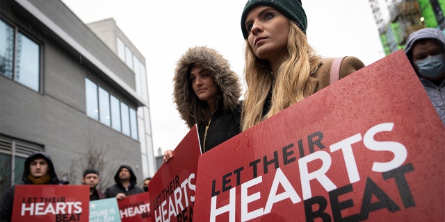 Anti-abortion activists protest outside a Planned Parenthood clinic on Jan. 20, 2022, in Washington.