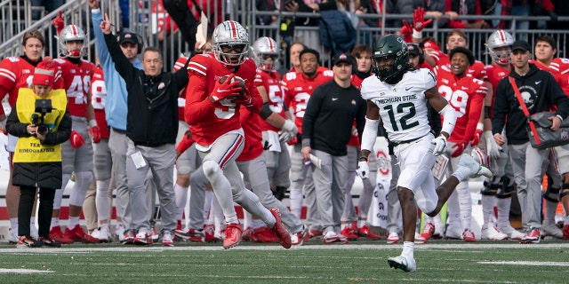 Ohio State Buckeyes cornerback Marcus Williamson (5) catches a pass during a game between the Ohio State Buckeyes and the Michigan State Spartans at Ohio Stadium in Columbus, Ohio, Nov. 20, 2021.
