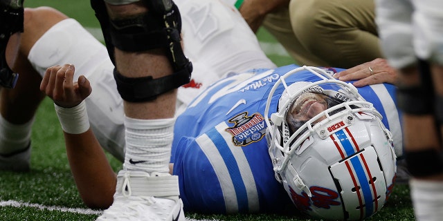 Matt Corral #2 of the Mississippi Rebels reacts after being injured against the Baylor Bears during the first quarter in the Allstate Sugar Bowl at Caesars Superdome on January 01, 2022 in New Orleans, Luisiana.