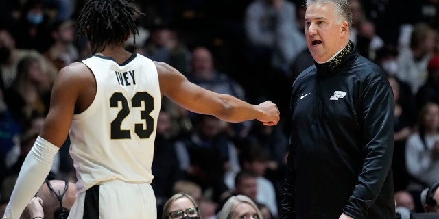 Purdue head coach Matt Painter, right, talks with his player Jaden Ivey while their team played Nebraska in the second half of an NCAA college basketball game in West Lafayette, Ind., Friday, Jan. 14, 2022. Purdue won 92-65.