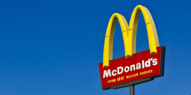 McDonalds sign in front of blue sky