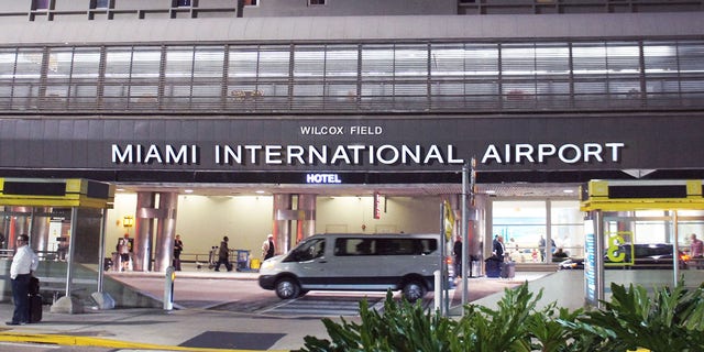 Miami, United States - February 13, 2016: People and cars move alongside the Terminal of Miami International Airport in Miami.