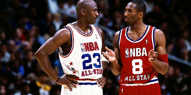 Kobe Bryant talks with Michael Jordan during the 2003 NBA All-Star Game at the Phillips Arena on Feb. 9, 2003 in Atlanta, Georgia.