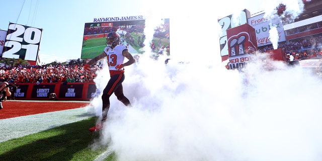 Mike Evans #13 of the Tampa Bay Buccaneers takes the field during player introductions prior to the NFC Wild Card Playoff game against the Philadelphia Eagles at Raymond James Stadium on January 16, 2022 in Tampa, Florida.