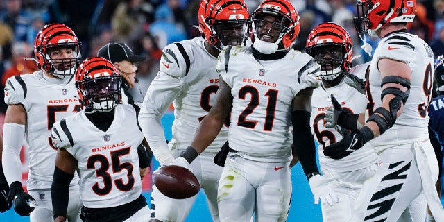 Cincinnati Bengals cornerback Mike Hilton (21) celebrates and interception he made against Tennessee Titans quarterback Ryan Tannehill (17) during the second half of an NFL divisional round playoff football game, Saturday, Jan. 22, 2022, in Nashville, Tenn.