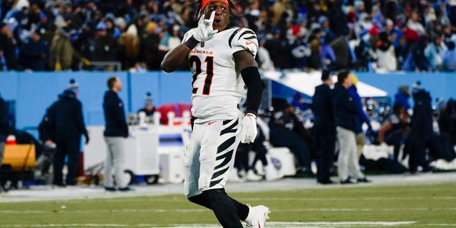 Cincinnati Bengals cornerback Mike Hilton (21) celebrates a win over the Tennessee Titans after an NFL divisional round playoff football game, Saturday, Jan. 22, 2022, in Nashville, Tenn. The Cincinnati Bengals won 19-16.