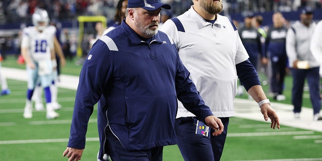 Head coach Mike McCarthy of the Dallas Cowboys walks off the field after losing to the San Francisco 49ers 23-17 in the NFC wild-card playoff game on Jan. 16, 2022, in Arlington, Texas.