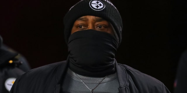 Head Coach Mike Tomlin of the Pittsburgh Steelers enters the field before the game against the Kansas City Chiefs in the NFC Wild Card Playoff game at Arrowhead Stadium on January 16, 2022 in Kansas City, Missouri.