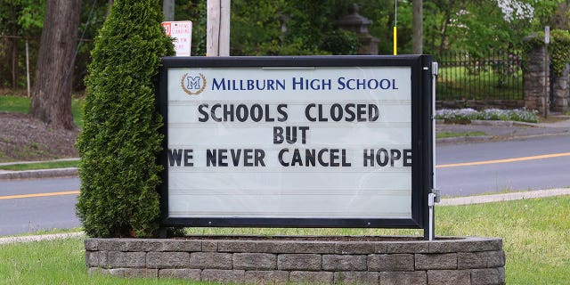 MILLBURN, NJ - MAY 09: A general view of the message board in front of Millburn High School during the Coronavirus (COVID-19) pandemic which reads, "Schools Closed but We Never Cancel Hope" on May 9, 2020 in Millburn, NJ.