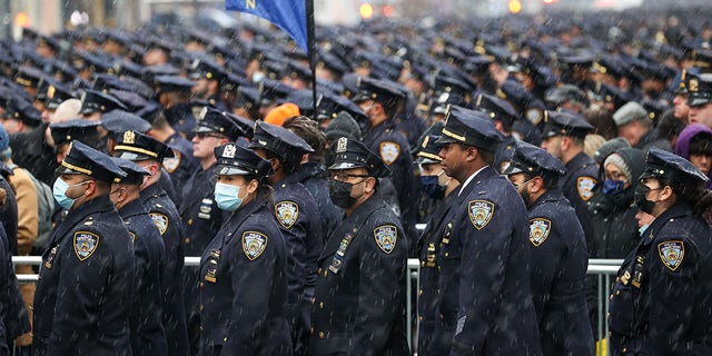 Thousands of NYPD officers attend the funeral of Officer Jason Rivera at St. Patrick's Cathedral in midtown Manhattan on Jan. 28, 2022. Officer Jason Rivera was shot and killed while responding to a domestic violence call last week; his partner, Officer Wilbert Mora was critically injured, and days later died. "The system continues to fail us," Rivera's widow said during her eulogy.