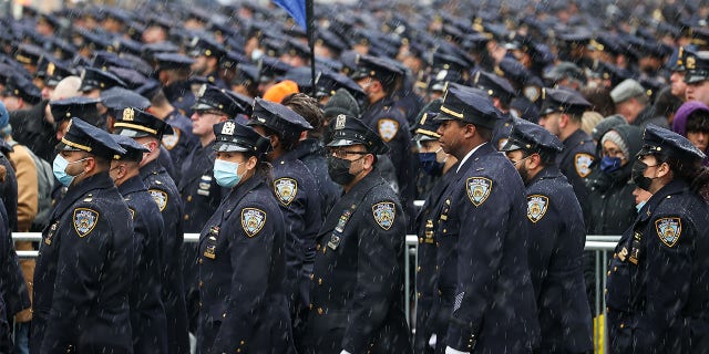 Thousands of NYPD officers attend the funeral of Officer Jason Rivera at St. Patrick's Cathedral in midtown Manhattan on Jan. 28, 2022. Officer Jason Rivera was shot and killed while responding to a domestic violence call last week; his partner, Officer Wilbert Mora was critically injured, and days later died. "The system continues to fail us," Rivera's widow said during her eulogy.