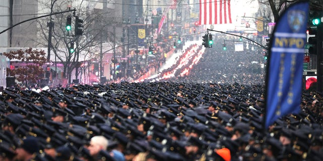 Thousands of police officers from across the country gather at St.  Patrick's Cathedral to attend the funeral of the fallen NYPD officer Jason Rivera on January 28, 2022 in New York City.