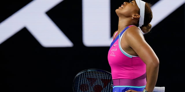 Naomi Osaka of Japan reacts during her third-round match against Amanda Anisimova of the U.S. at the Australian Open tennis championships in Melbourne, Australia, Friday, Jan. 21, 2022.