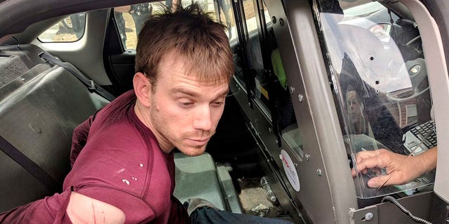 Travis Reinking, the suspect in a Waffle House shooting in Nashville, is arrested in Antioch, Tennessee, April 23, 2018. (Nashville police via Reuters)