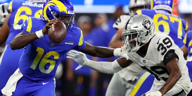 Bryce Perkins #16 of the Los Angeles Rams looks to pass against Nate Hobbs #39 of the Las Vegas Raiders in the first half at SoFi Stadium on August 21, 2021 in Inglewood, California.